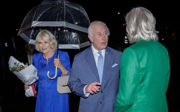 Britain's King Charles III speaks to Australia's Governor-General Sam Mostyn (R) after he and Queen Camilla arrived at Sydney International Airport in Sydney on October 18, 2024, for a six-day royal visit to Sydney and Canberra. (Photo by Brook Mitchell / POOL / AFP)